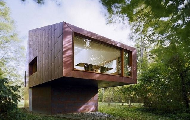 Um modelo de casa moderno e original para uma casa de campo Um modelo de casa moderno e original para uma casa de campo